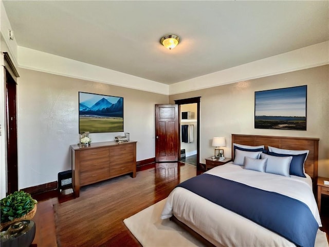 bedroom featuring dark wood-type flooring