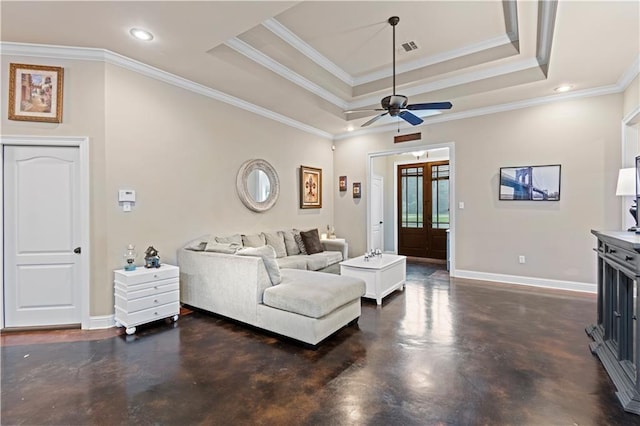 living room featuring french doors, crown molding, and a raised ceiling