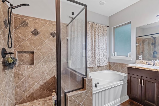 bathroom featuring vanity and plus walk in shower