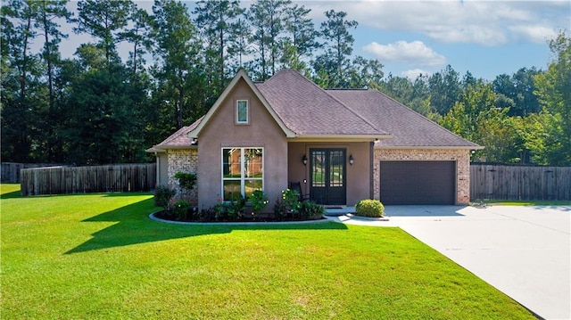 view of front facade with a garage and a front yard