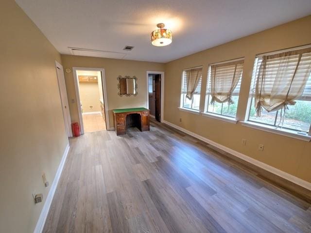 unfurnished living room with hardwood / wood-style floors