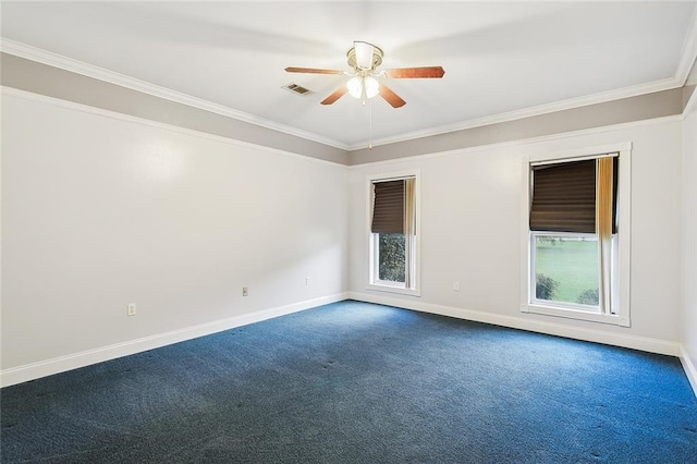 carpeted spare room with ceiling fan and ornamental molding