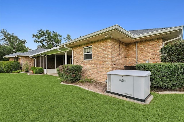 back of property featuring a yard