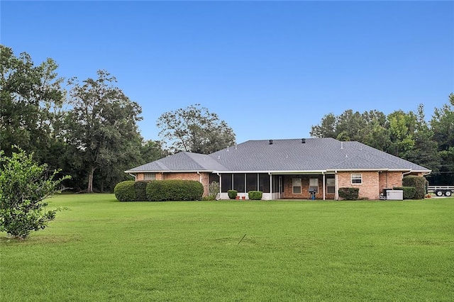 back of house with a yard