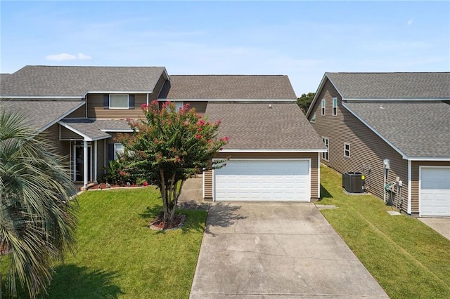 view of front facade featuring a garage, central AC unit, and a front lawn