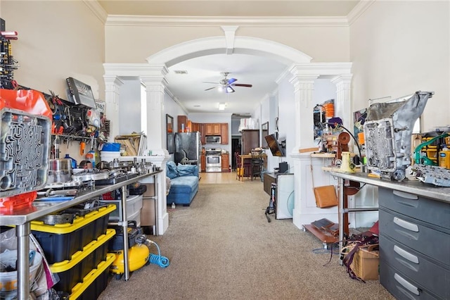 misc room with ceiling fan, ornate columns, crown molding, and light carpet