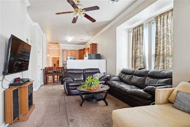 carpeted living room featuring ceiling fan and ornamental molding