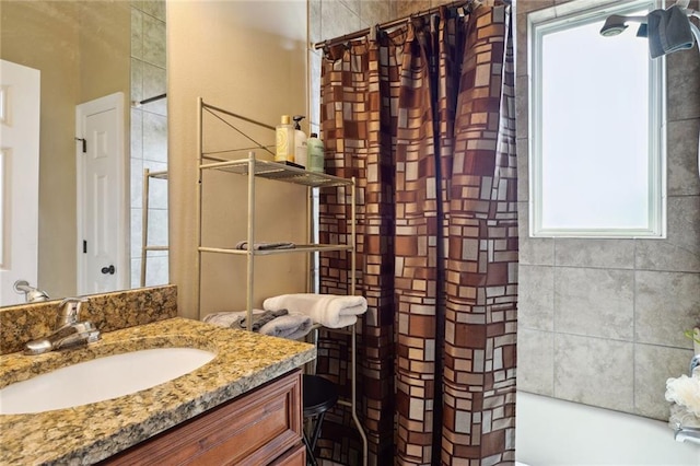 bathroom featuring shower / bath combination with curtain and vanity