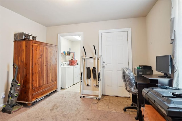 office area featuring washing machine and dryer and light tile patterned floors