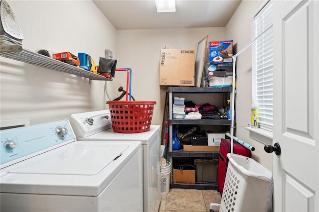 laundry area with light tile patterned flooring and independent washer and dryer