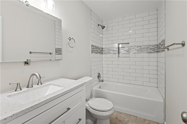 full bathroom featuring tile patterned flooring, vanity, tiled shower / bath combo, and toilet