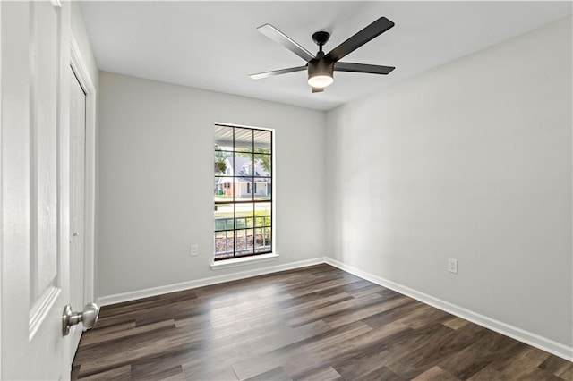 unfurnished room featuring ceiling fan and dark hardwood / wood-style flooring