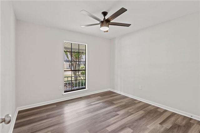 spare room featuring ceiling fan and wood-type flooring