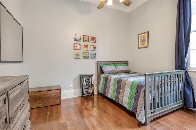 bedroom featuring ceiling fan and wood-type flooring