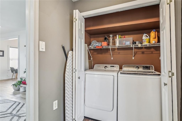 washroom featuring separate washer and dryer and wood-type flooring