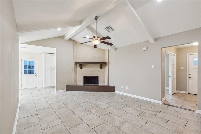 unfurnished living room featuring vaulted ceiling with beams, light tile patterned floors, a high end fireplace, and ceiling fan