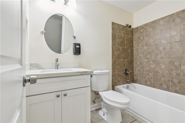 full bathroom with toilet, vanity, tiled shower / bath, and tile patterned floors