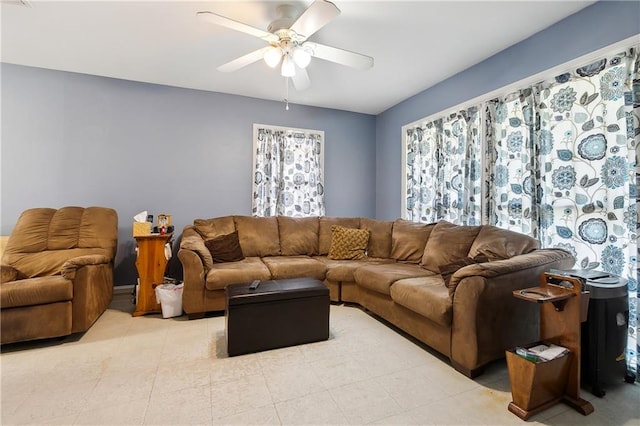 living room featuring ceiling fan and light tile patterned flooring