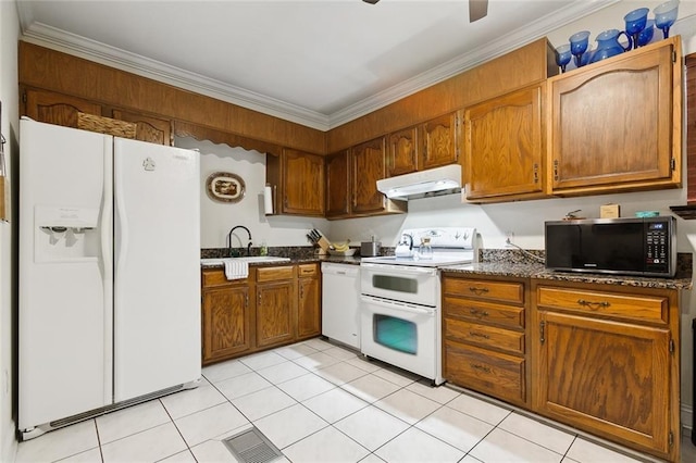 kitchen featuring visible vents, ornamental molding, a sink, white appliances, and under cabinet range hood