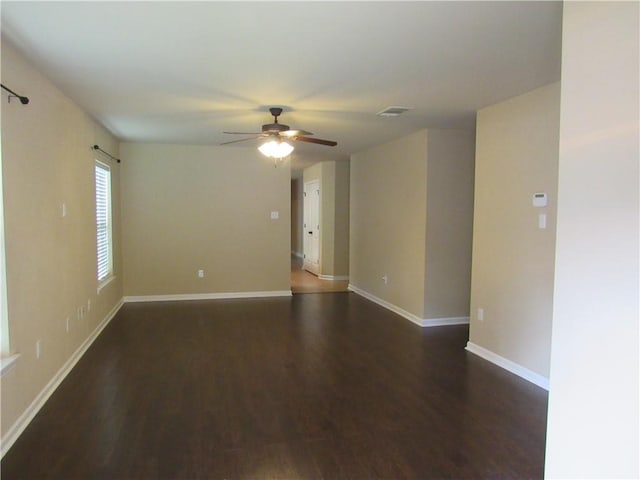 empty room featuring ceiling fan and hardwood / wood-style flooring