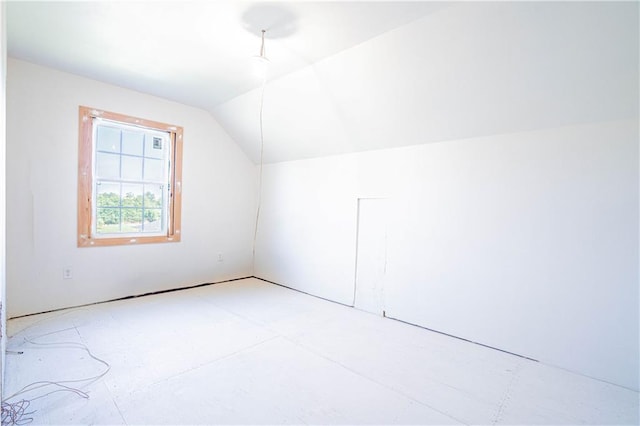 additional living space with vaulted ceiling