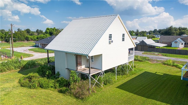 rear view of house with a lawn