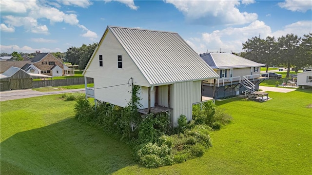 view of side of property with a lawn