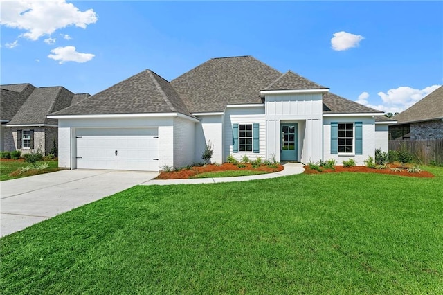 view of front facade with a front lawn and a garage