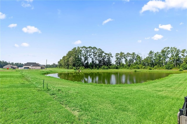 exterior space with a yard and a water view