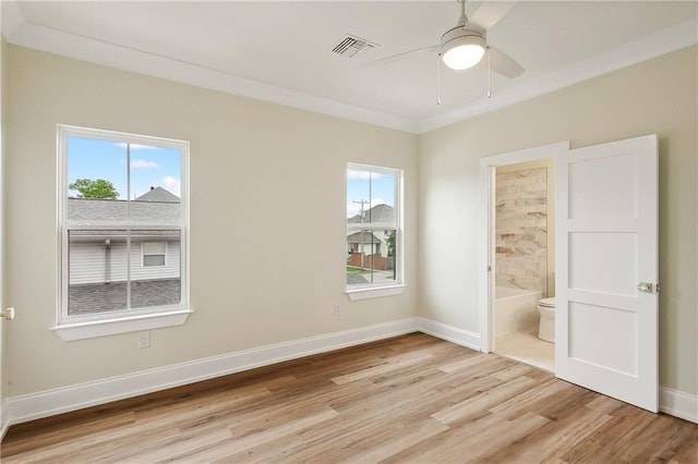 unfurnished bedroom with ceiling fan, light hardwood / wood-style flooring, crown molding, and ensuite bathroom