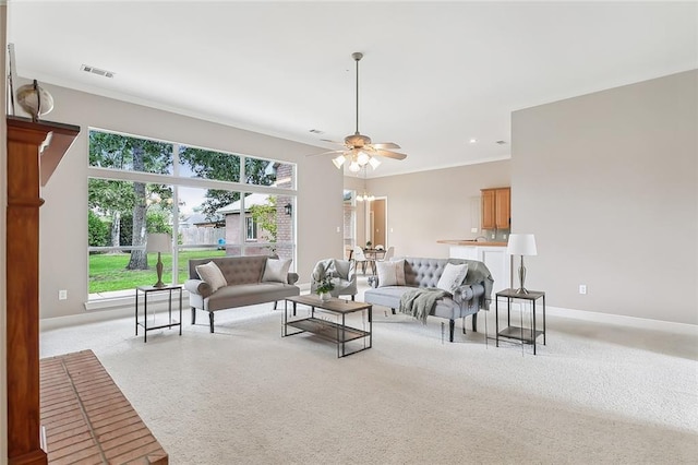 living room with crown molding and ceiling fan