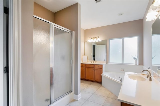 bathroom with tile patterned flooring, vanity, and shower with separate bathtub