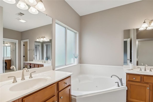 bathroom with vanity, a chandelier, and plus walk in shower