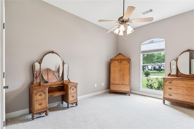 interior space featuring ceiling fan and carpet flooring