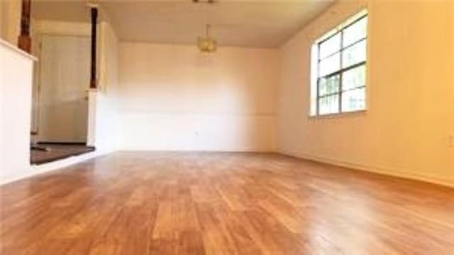 spare room featuring hardwood / wood-style flooring