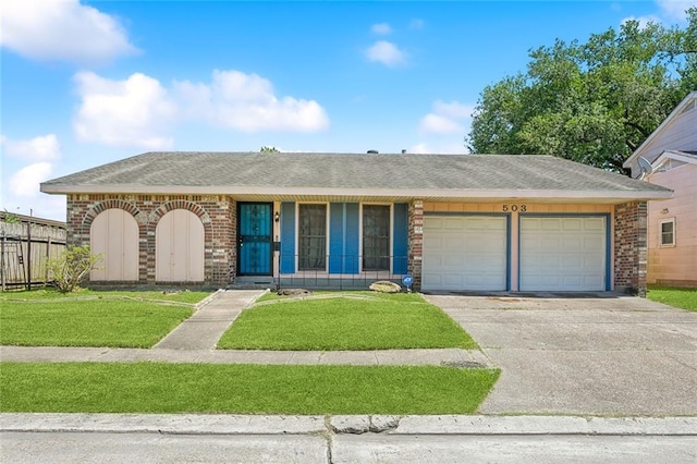 503 Wright Ave, Terrytown, LA 70056 - ranch-style house featuring concrete driveway, brick siding, an attached garage, and a front yard