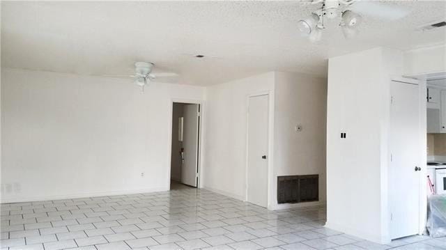 503 Wright Ave, Terrytown, LA 70056 - spare room with visible vents, baseboards, ceiling fan, and light tile patterned floors