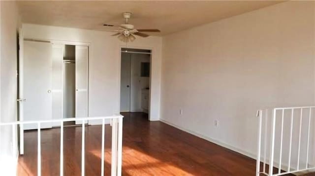 unfurnished bedroom featuring wood-type flooring, ceiling fan, and a closet