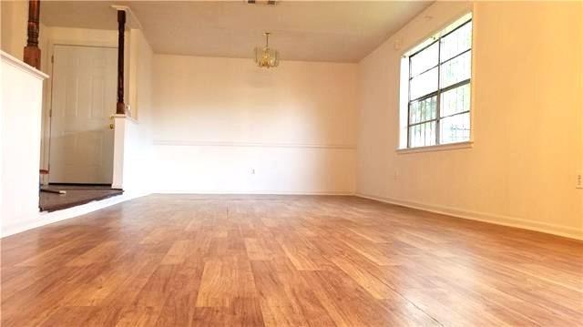 503 Wright Ave, Terrytown, LA 70056 - spare room featuring an inviting chandelier and wood finished floors