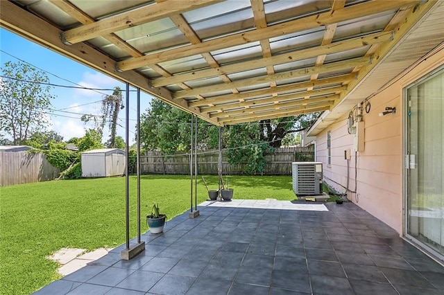 503 Wright Ave, Terrytown, LA 70056 - view of patio with central air condition unit, a storage unit, an outbuilding, and a fenced backyard