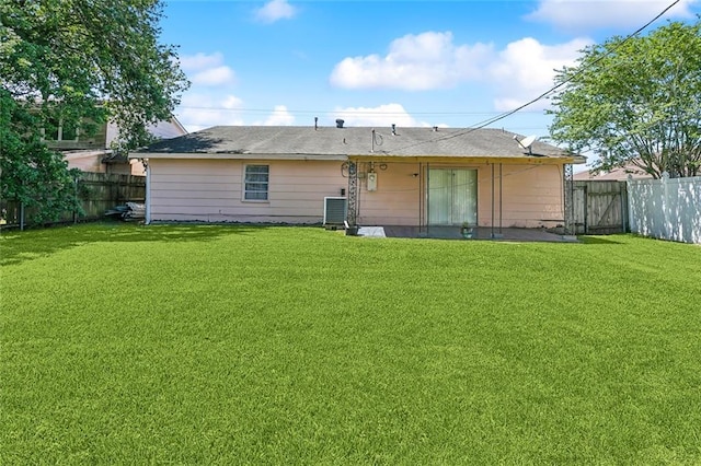 503 Wright Ave, Terrytown, LA 70056 - back of house with a lawn, a fenced backyard, and cooling unit