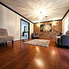 living room with ornamental molding and dark hardwood / wood-style flooring