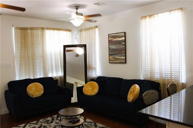 living room featuring ceiling fan and wood-type flooring