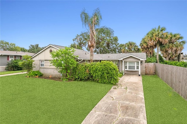 single story home with a front yard