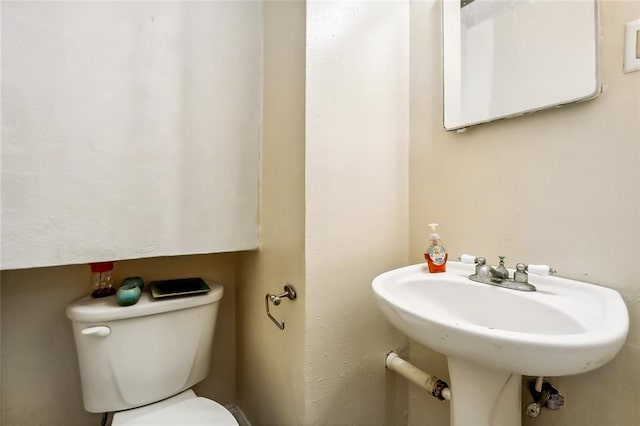 bathroom featuring toilet