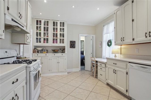 kitchen with white cabinetry, crown molding, light tile patterned flooring, and white appliances