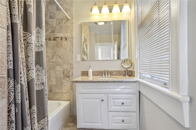 bathroom featuring shower / bath combo, tile patterned floors, and vanity