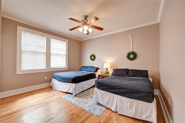 bedroom with ceiling fan, light wood-type flooring, and crown molding