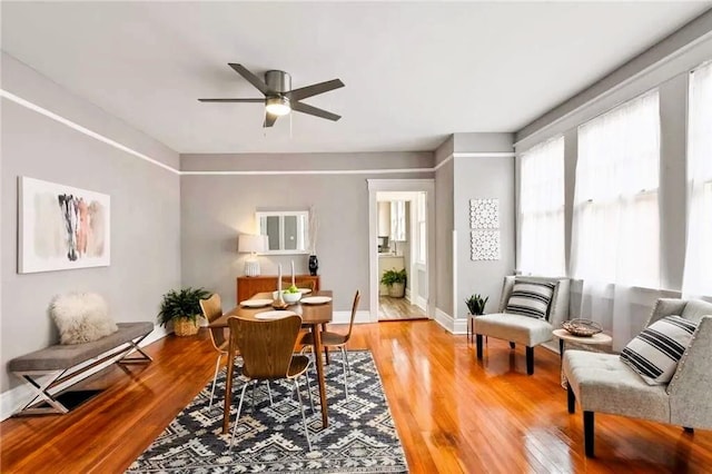 interior space with ceiling fan and hardwood / wood-style flooring