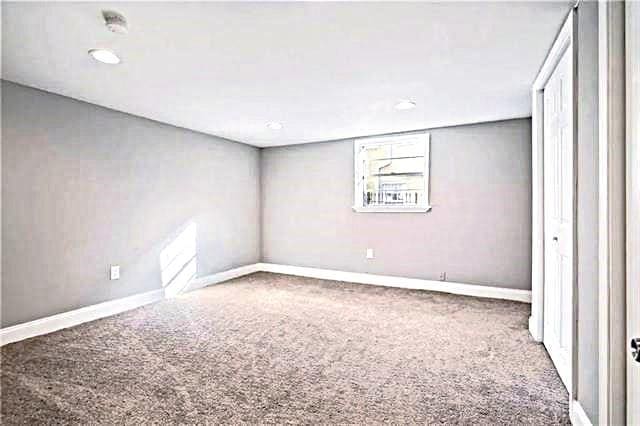 1831 S Dupre St, New Orleans, LA 70125 - unfurnished bedroom with baseboards and carpet floors